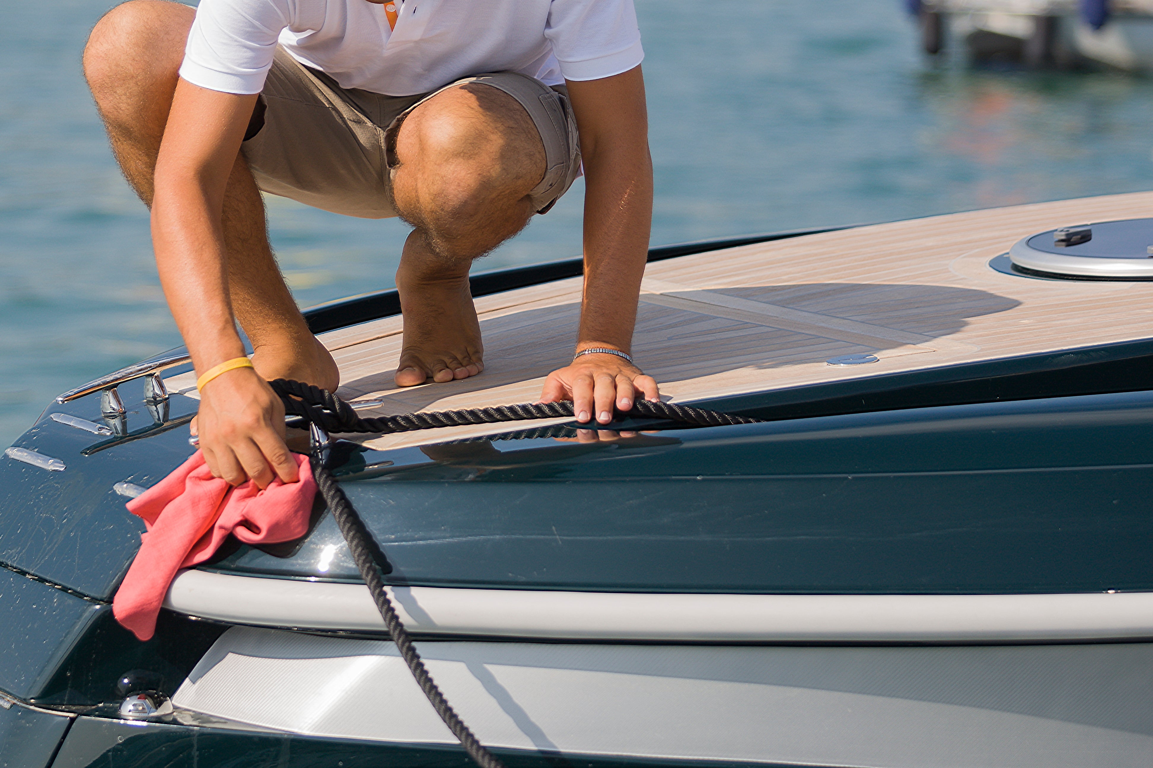 A man cleaning a boat