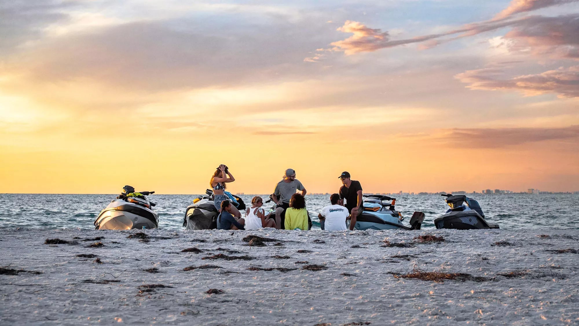 People meeting up on the beach with Sea-Doo